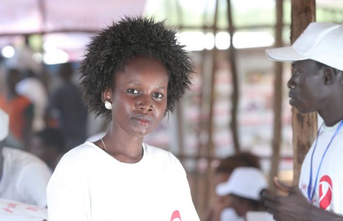 Nyanhial Gach, 22 years old mother, at Gameblla Stadium testing site, Gambella Regional State, Ethiopia, 30 November 2014.