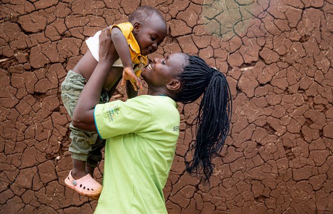 Phiona (38 yrs) at her home with her youngest son. Phiona works as a Peer Mother at the Rugaga IV Health Centre in Uganda. Through the program, a number of peer mothers have been trained, mentored and facilitated to support mothers to deliver HIV free bab