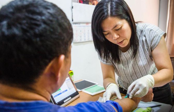 Photo: A male patient is being tested for HIV at MAP Foundation Health Testing Center, Chiang Mai, Thailand. The Global Fund/Jonas Gratzer.