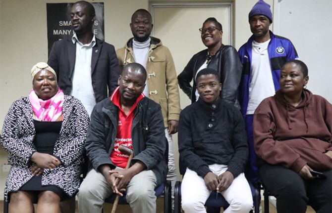 LIVING POSITIVELY WITH HIV: Hannie Dlamini (in red T-Shirt) was the first person living with HIV to publicly declare his HIV status in Eswatini. He has been living with HIV for 32 years. ©UNAIDS 2023.