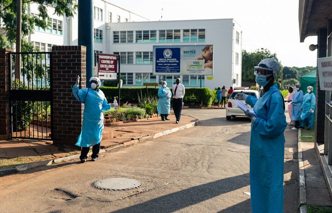 Medical staff at Parirenyatwa hospital screen visitors for high temperatures and give hand sanitiser to wash hands for all entering Zimbabwe's main referral hospital as the country tries to stop the spread of the COVID-19 virus after it registered its fir