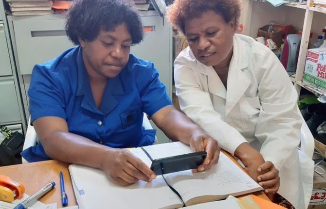 Nurse Kaumb and Sister Tmek of the PPTCT Team accessing training. Mt Hagen General Hospital, Western Highlands, Papua New Guinea