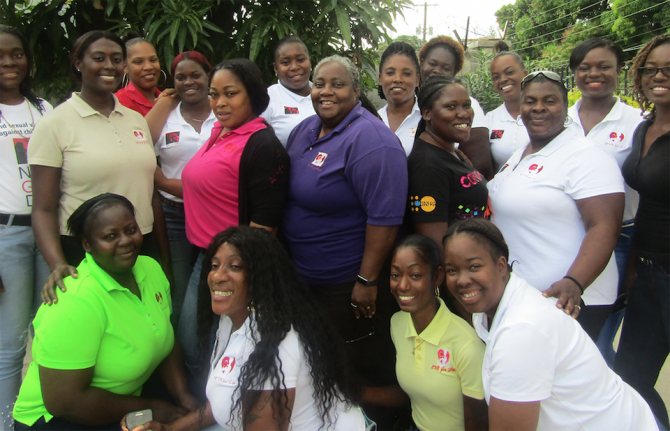 Joy Crawford, co-founder of Eve for Life (centre in purple shirt) together with members of the organisation. Credit:UNICEF