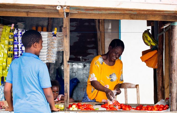 Caroline Damiani, a single mother of three, has been living with HIV since 1998. She sells groceries at a small kiosk and rears ducks and chickens to sell in Temeke, Dar es Salaam, Tanzania. November 2020. Credit: UNAIDS/Daniel Msirikale