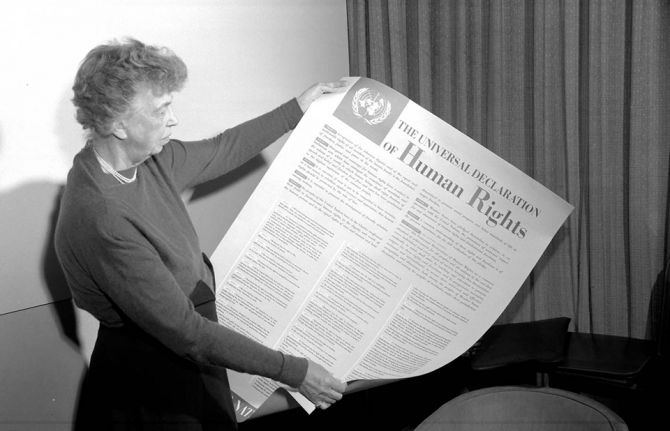 Mrs. Eleanor Roosevelt of the United States holding a Declaration of Human Rights poster in English. [November 1949] UN Photo